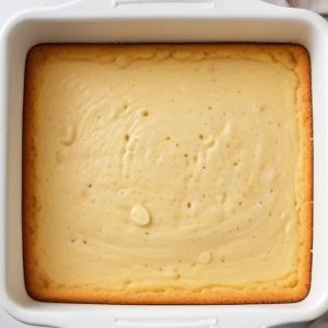 this-image-shows-the-process-of-pouring-banana-cake-batter-into-baking-dish